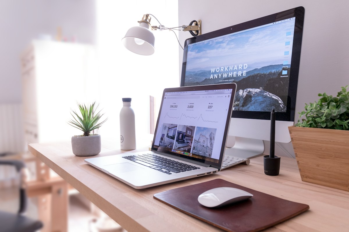 Minimal desk with laptop and monitor